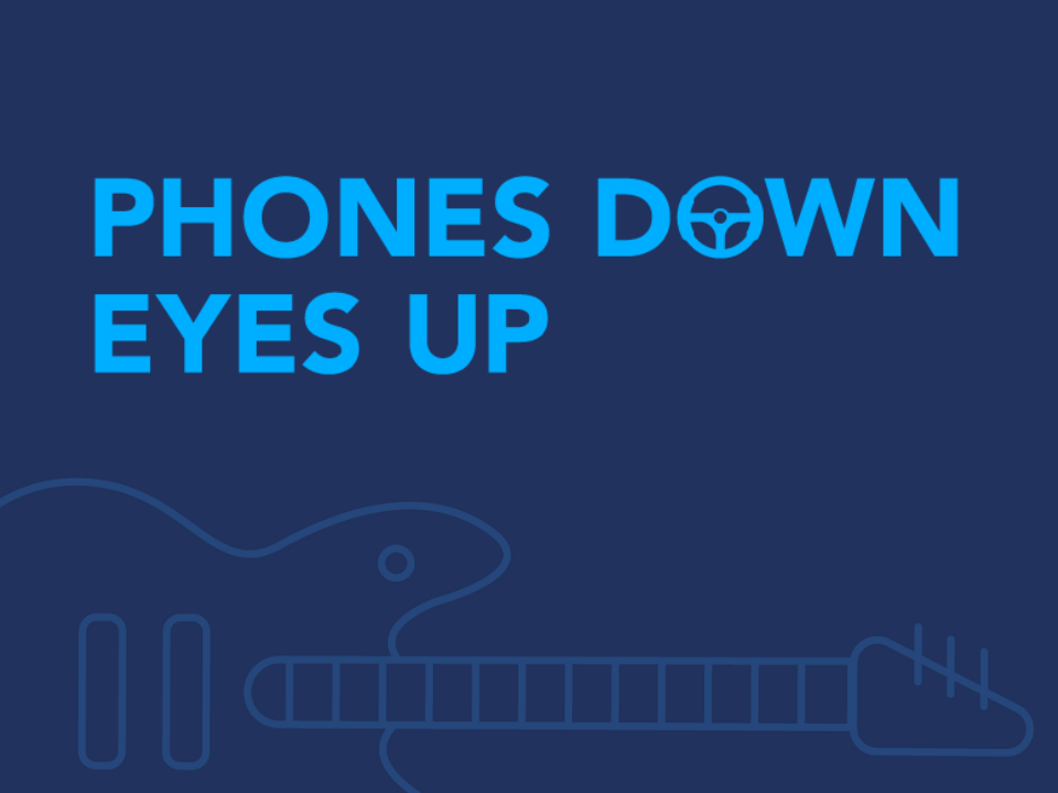 "Phones Down, Eyes Up" logo